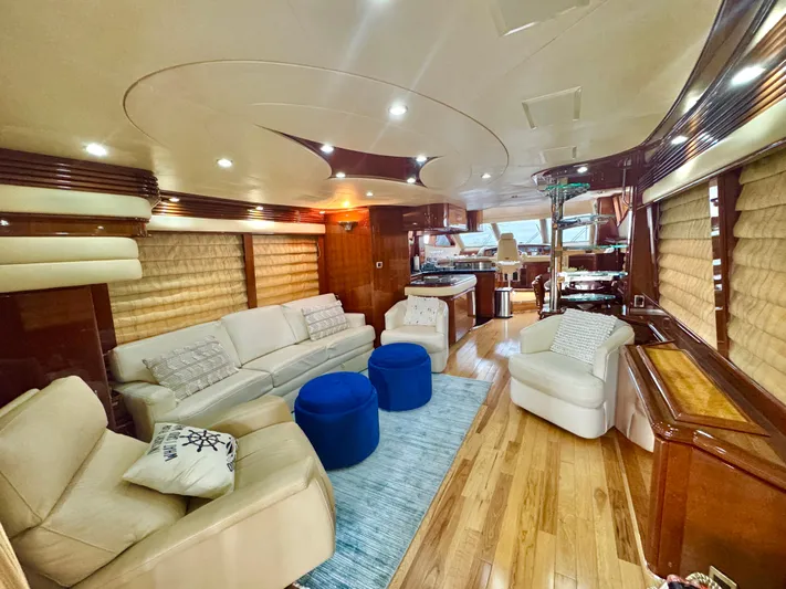  Yacht Photos Pics Luxurious interior of a 2006 Marquis 65 yacht with elegant seating and modern decor.