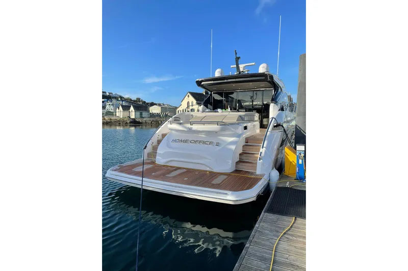 Home Office II Yacht Photos Pics 2023 Princess V60 yacht docked, featuring elegant design and spacious deck.