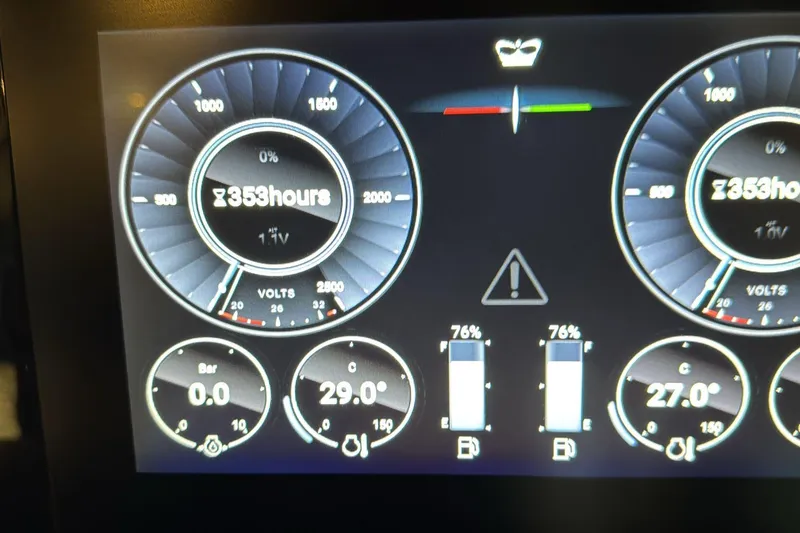 Home Office II Yacht Photos Pics Dashboard display of 2023 Princess V60 yacht showing engine hours and fuel levels.