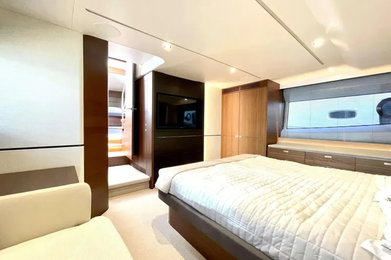 Home Office II Yacht Photos Pics Luxurious bedroom interior of 2023 Princess V60 yacht with modern design and elegant furnishings.