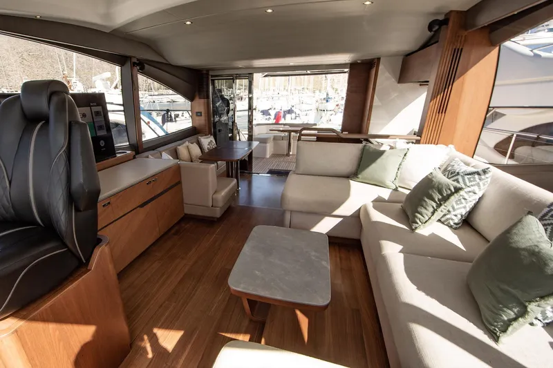 Home Office II Yacht Photos Pics Luxurious interior of 2023 Princess V60 yacht with elegant seating and modern design.