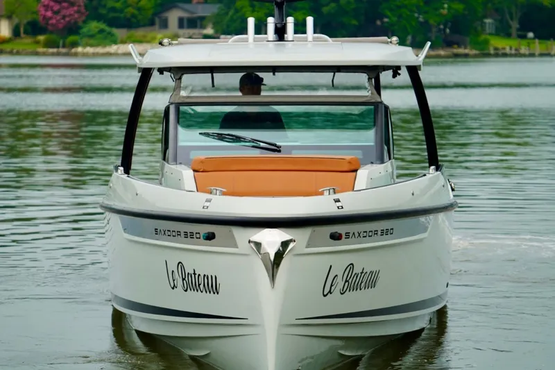 Yacht Photos Pics 2023 Saxdor 320 GTO boat on calm water, front view with "Le Bateau" text.