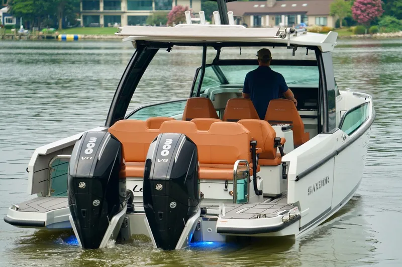  Yacht Photos Pics 2023 Saxdor 320 GTO boat with dual 300 V8 engines on a calm lake.