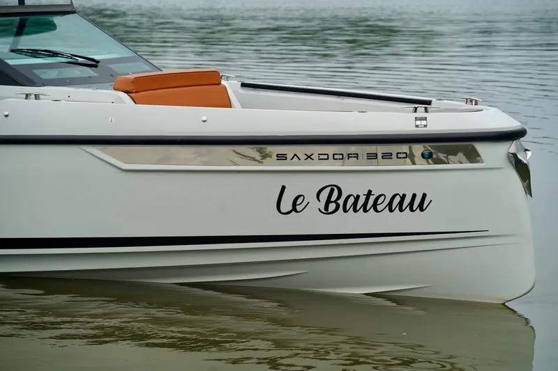  Yacht Photos Pics 2023 Saxdor 320 GTO boat named "Le Bateau" on calm water.