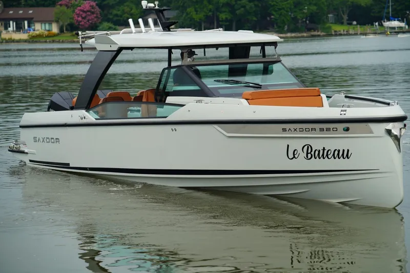  Yacht Photos Pics 2023 Saxdor 320 GTO boat named "Le Bateau" on calm water.