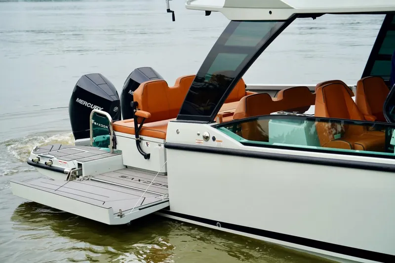  Yacht Photos Pics 2023 Saxdor 320 GTO boat with Mercury engines, featuring sleek design and luxurious seating.