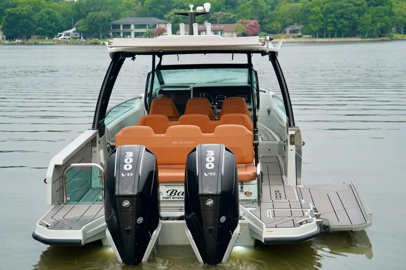  Yacht Photos Pics 2023 Saxdor 320 GTO boat with dual 300 V8 engines on a calm lake.