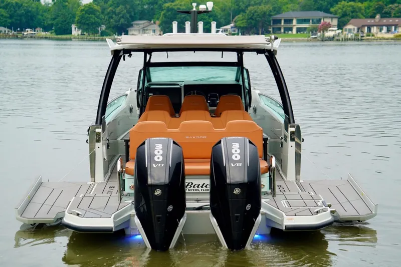  Yacht Photos Pics 2023 Saxdor 320 GTO boat with dual 300 V8 engines on a calm lake.