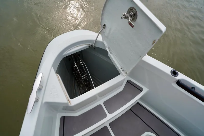  Yacht Photos Pics Open storage compartment on 2023 Saxdor 320 GTO boat, showing interior details.