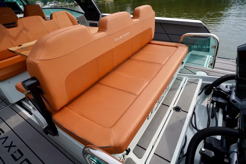  Yacht Photos Pics 2023 Saxdor 320 GTO boat with tan leather seating, sleek design, and modern features.