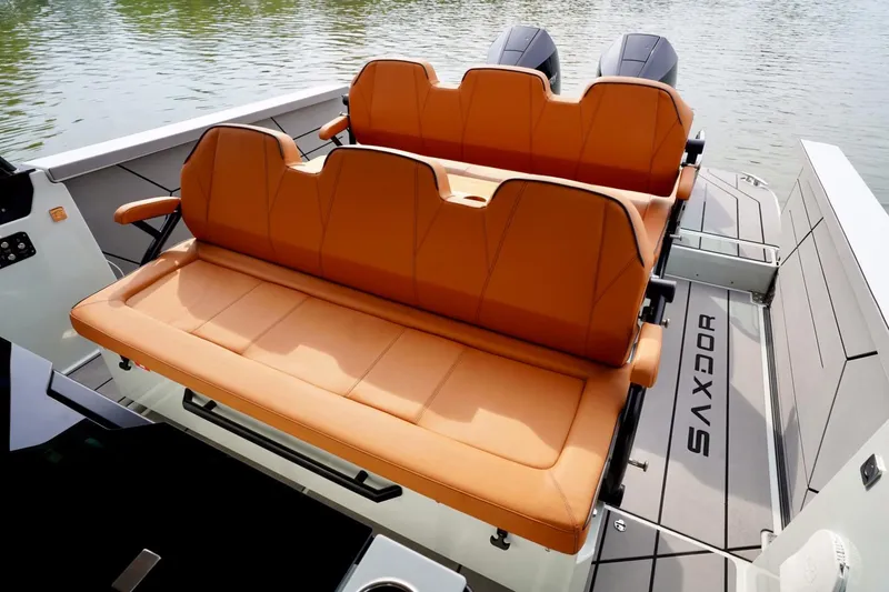  Yacht Photos Pics 2023 Saxdor 320 GTO boat with orange seating, sleek design, and dual engines.