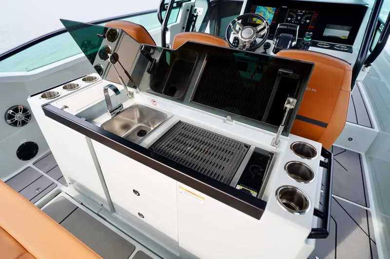 Yacht Photos Pics 2023 Saxdor 320 GTO boat interior with grill, sink, and modern dashboard.