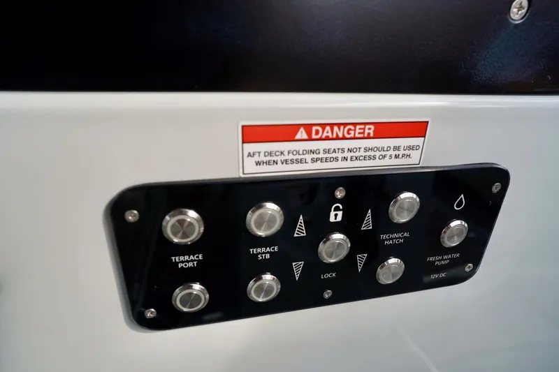  Yacht Photos Pics Control panel on 2023 Saxdor 320 GTO boat with safety warning label.