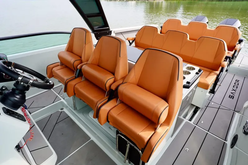  Yacht Photos Pics 2023 Saxdor 320 GTO boat interior with luxurious orange seating and sleek design.