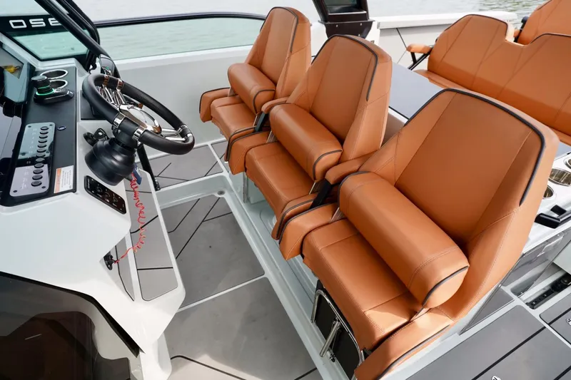  Yacht Photos Pics 2023 Saxdor 320 GTO interior with luxurious tan leather seats and modern steering console.