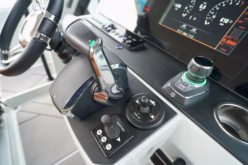  Yacht Photos Pics Control panel of 2023 Saxdor 320 GTO boat with steering wheel and digital display.