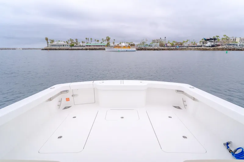 Champion Yacht Photos Pics 2022 Viking 38 Open Billfish boat deck with ocean view and distant shoreline.