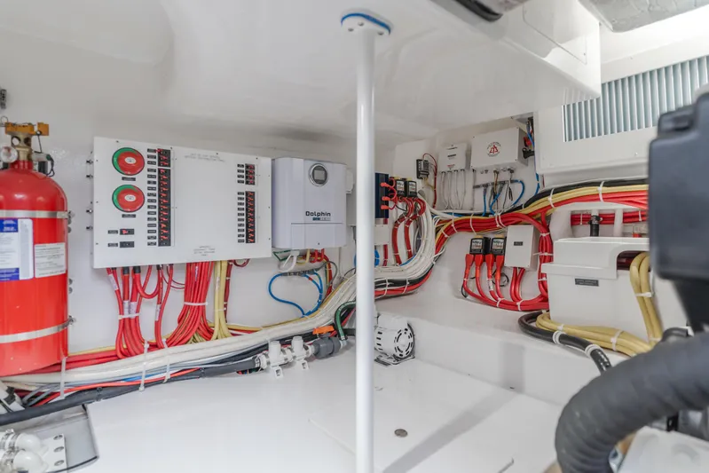 Champion Yacht Photos Pics Electrical system of 2022 Viking 38 Open Billfish with wiring and control panels.