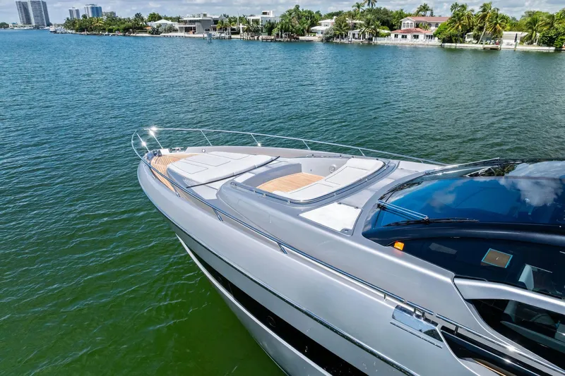 Dreaming Yacht Photos Pics Luxury 2023 Riva 76 PERSEO Super yacht on serene water, showcasing sleek design.