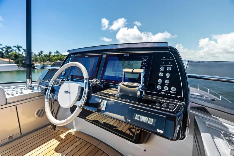 Dreaming Yacht Photos Pics Cockpit of 2023 Riva 76 PERSEO Super yacht with modern controls and steering wheel.
