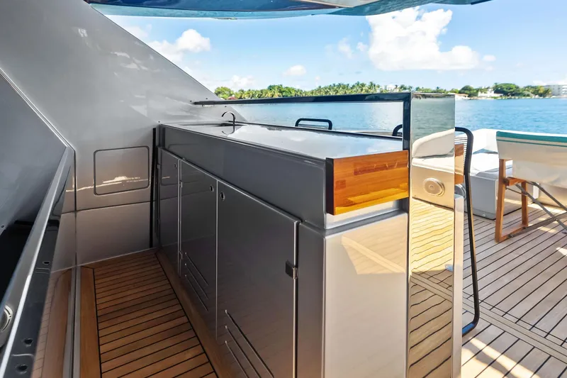 Dreaming Yacht Photos Pics Luxurious 2023 Riva 76 PERSEO Super yacht deck with sleek cabinetry and ocean view.