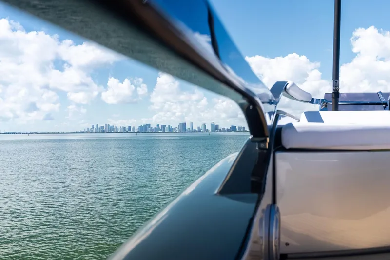 Dreaming Yacht Photos Pics Luxury Riva 76 PERSEO Super yacht with city skyline in the background, 2023 model.