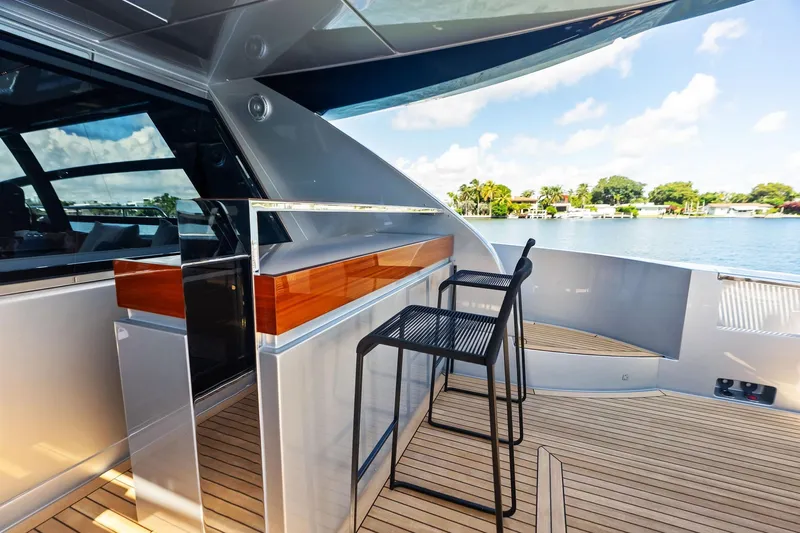 Dreaming Yacht Photos Pics Luxury deck of 2023 Riva 76 PERSEO Super yacht with modern seating and scenic view.