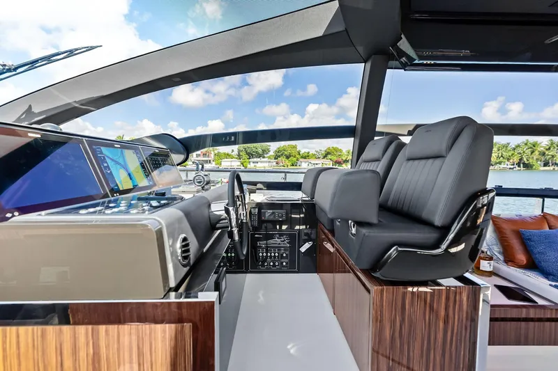 Dreaming Yacht Photos Pics Luxurious interior of 2023 Riva 76 PERSEO Super yacht with modern helm and plush seating.