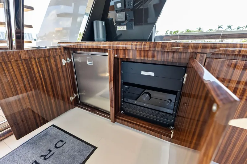 Dreaming Yacht Photos Pics Luxurious interior of 2023 Riva 76 PERSEO Super yacht with wood cabinetry and modern appliances.