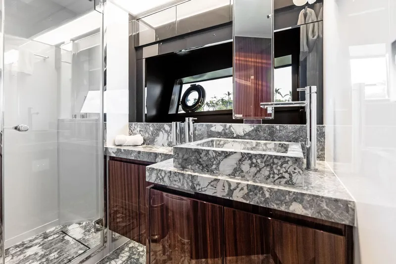 Dreaming Yacht Photos Pics Luxurious bathroom interior of 2023 Riva 76 PERSEO Super yacht with marble countertops.