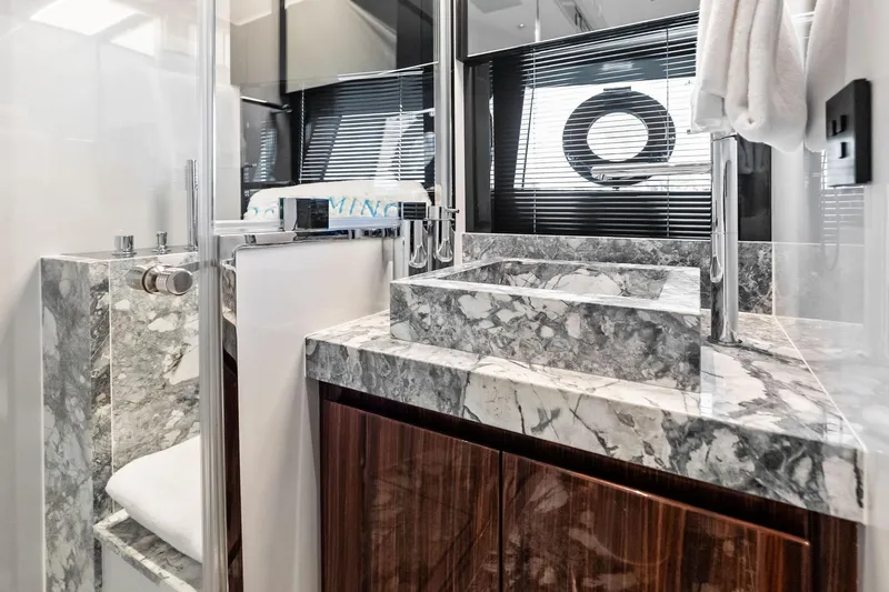 Dreaming Yacht Photos Pics Luxurious bathroom in 2023 Riva 76 PERSEO Super yacht with marble sink and modern fixtures.