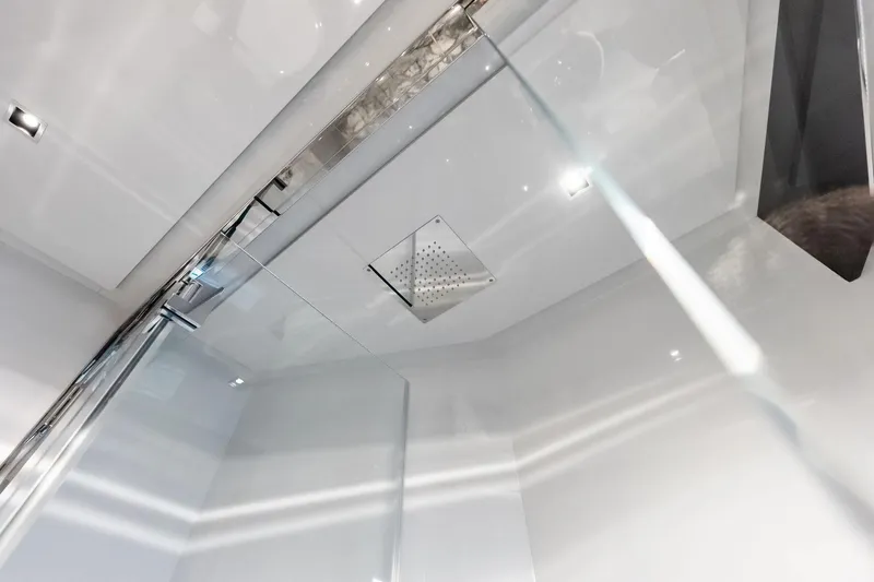 Dreaming Yacht Photos Pics Modern shower interior on 2023 Riva 76 PERSEO Super yacht, featuring sleek glass and chrome fixtures.