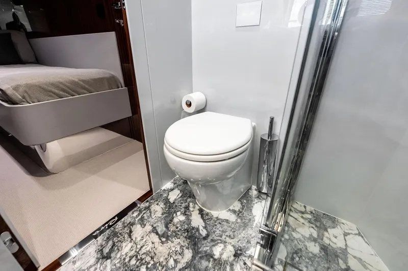 Dreaming Yacht Photos Pics Luxurious bathroom on 2023 Riva 76 PERSEO Super yacht with marble flooring.