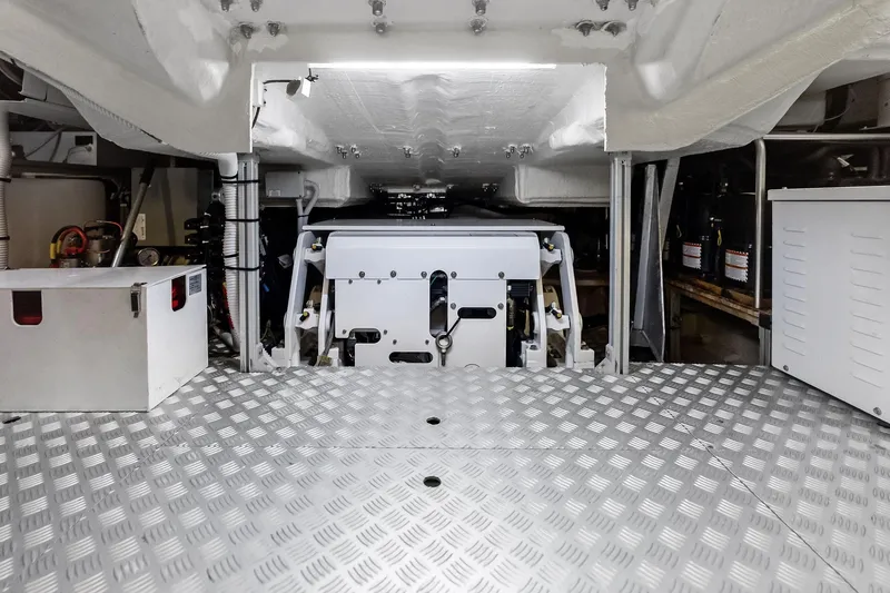 Dreaming Yacht Photos Pics Engine room of 2023 Riva 76 PERSEO Super yacht, featuring modern equipment and metallic flooring.