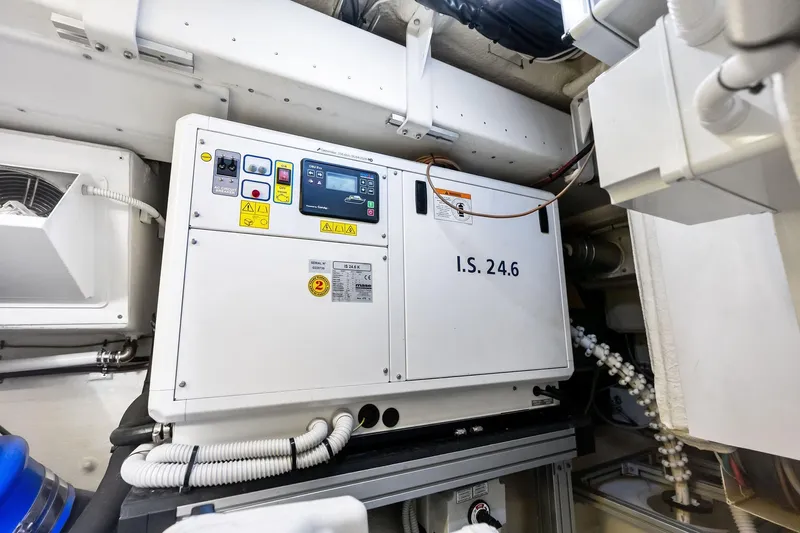 Dreaming Yacht Photos Pics Engine room of 2023 Riva 76 PERSEO Super yacht, featuring control panel and wiring.