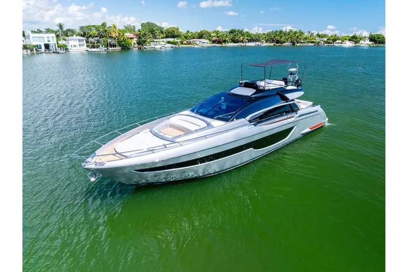 Dreaming Yacht Photos Pics Luxury 2023 Riva 76 PERSEO Super yacht cruising on a serene, sunny waterway.