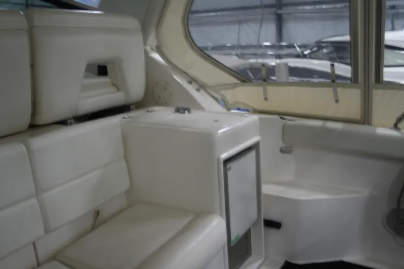  Yacht Photos Pics Interior of 2001 Tiara Yachts 4000 Express, featuring white seating and compact design.
