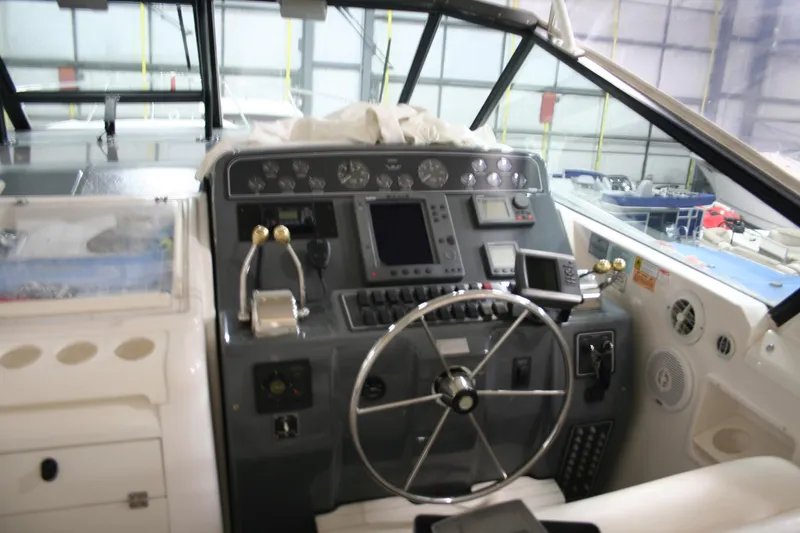  Yacht Photos Pics 2001 Tiara Yachts 4000 Express helm with steering wheel and navigation controls.