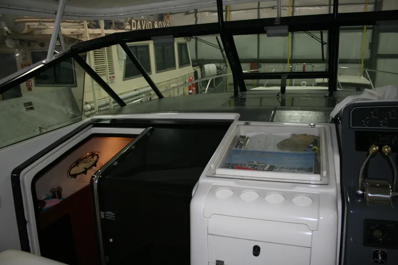  Yacht Photos Pics 2001 Tiara Yachts 4000 Express cockpit with control panel and navigation equipment.