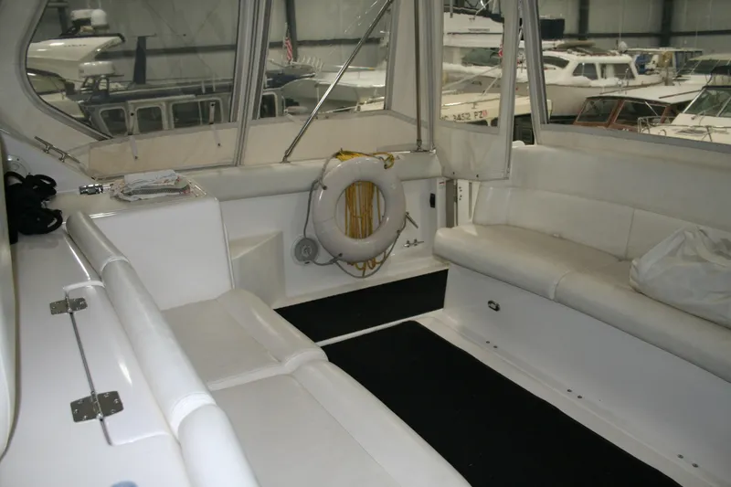  Yacht Photos Pics 2001 Tiara Yachts 4000 Express interior with white seating and life preserver.