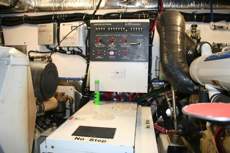  Yacht Photos Pics Engine room of 2001 Tiara Yachts 4000 Express with control panel and machinery.
