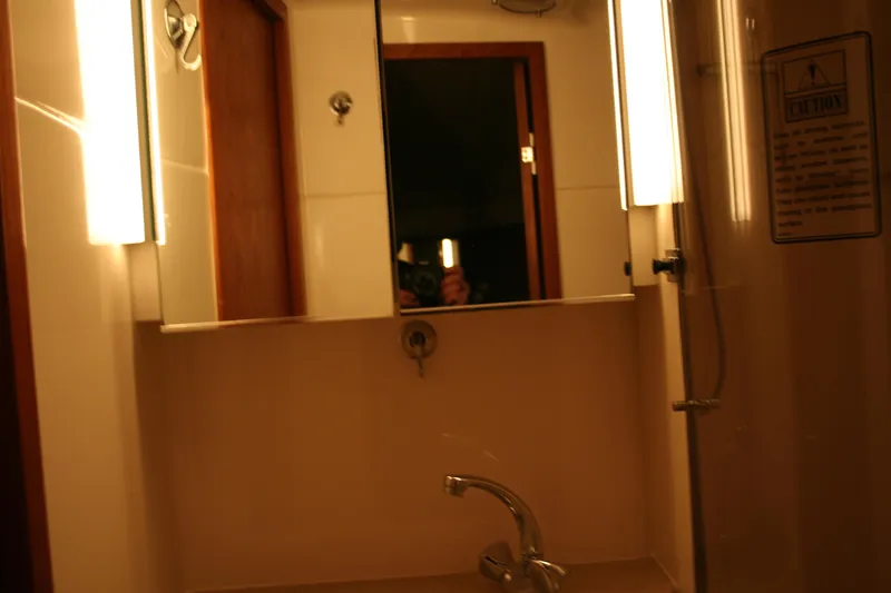  Yacht Photos Pics Bathroom interior of 2001 Tiara Yachts 4000 Express with mirror and lighting.