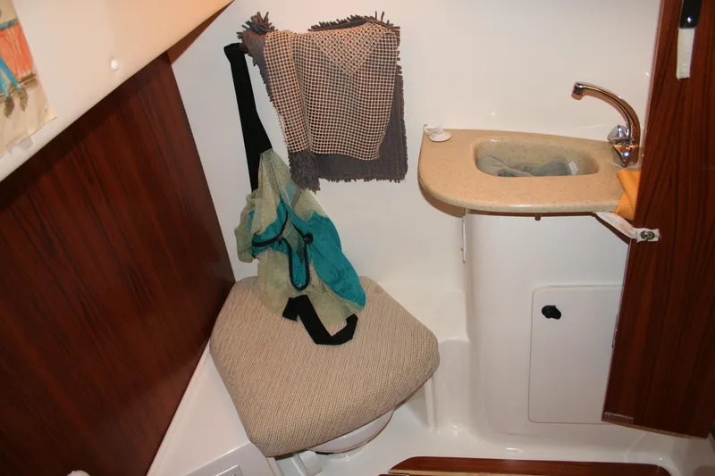  Yacht Photos Pics Bathroom interior of 2001 Tiara Yachts 4000 Express with sink and seat.