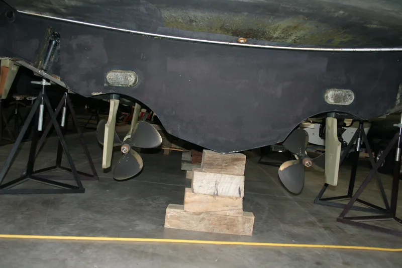  Yacht Photos Pics 2001 Tiara Yachts 4000 Express propellers and hull on blocks in a workshop.