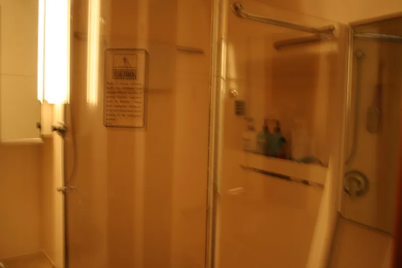  Yacht Photos Pics Bathroom interior of 2001 Tiara Yachts 4000 Express with shower and glass door.