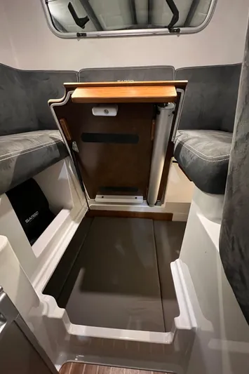  Yacht Photos Pics Interior seating and table area of a 2021 Sargo 25 boat.
