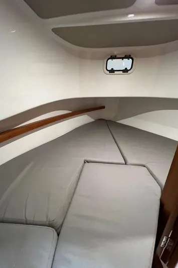  Yacht Photos Pics 2021 Sargo 25 boat interior cabin with cushioned sleeping area.