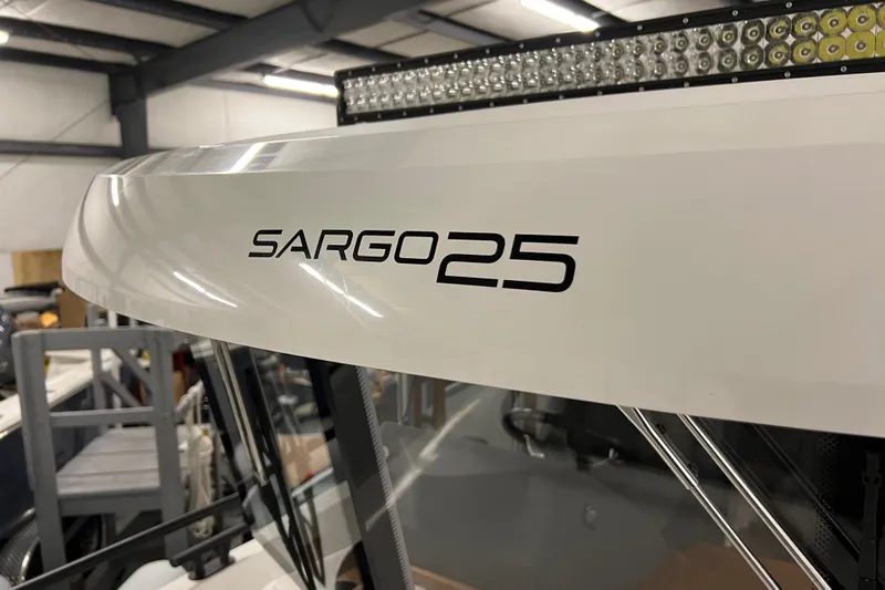  Yacht Photos Pics Close-up of 2021 Sargo 25 boat model name on white exterior.