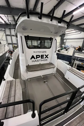  Yacht Photos Pics 2021 Sargo 25 boat in a warehouse, featuring APEX HASTINGS branding.