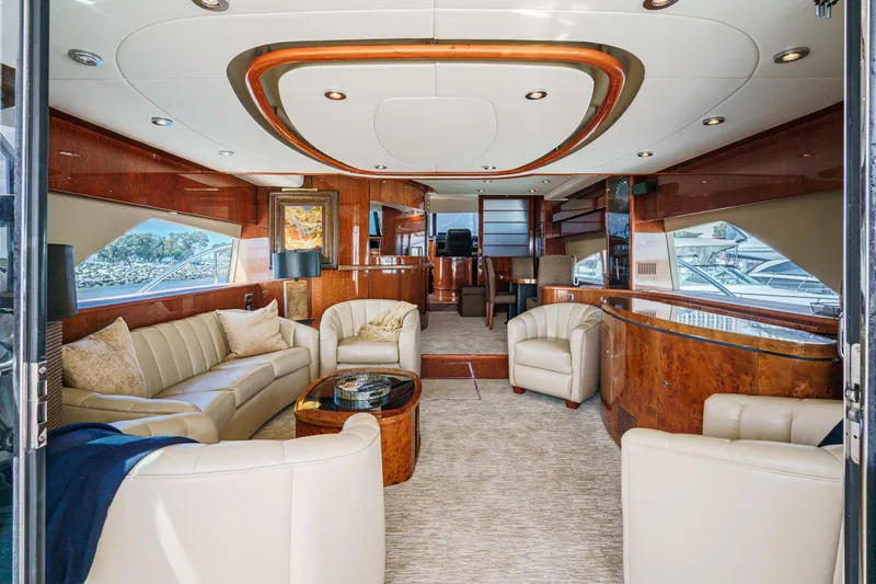 Compass Rose Yacht Photos Pics Luxurious interior of 2006 Fairline 74 Custom yacht with elegant seating and wood finishes.